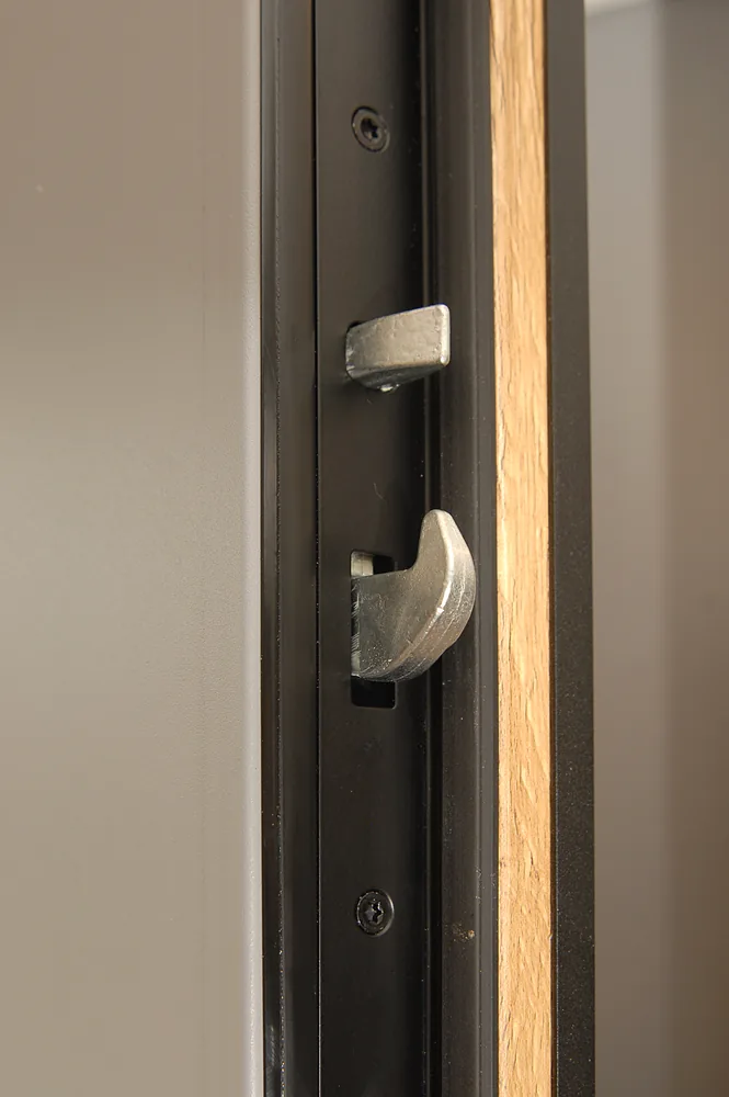 Hurricane door hook-bolt and steel strike plate engaged — RC2 and PAS24 multi-point locking
